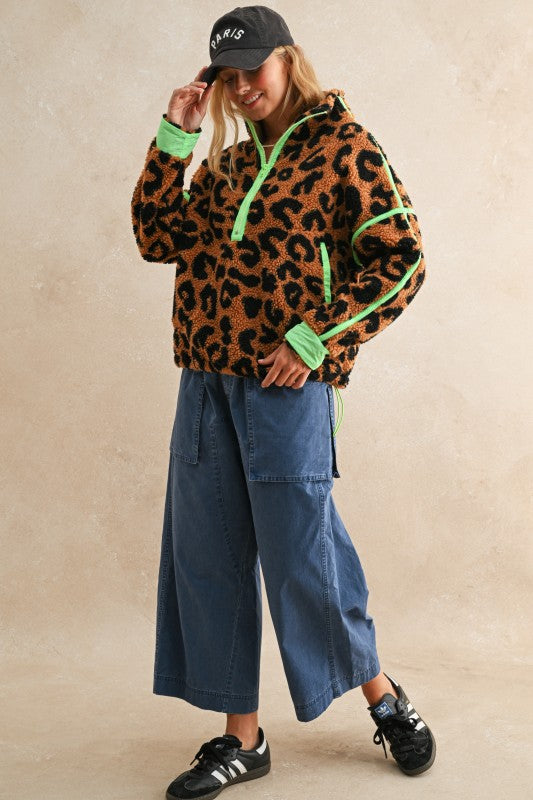 Stay cozy and fierce this fall and winter in the Leopard Sherpa Pullover